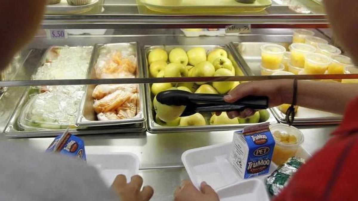 A student goes through a school lunch line.