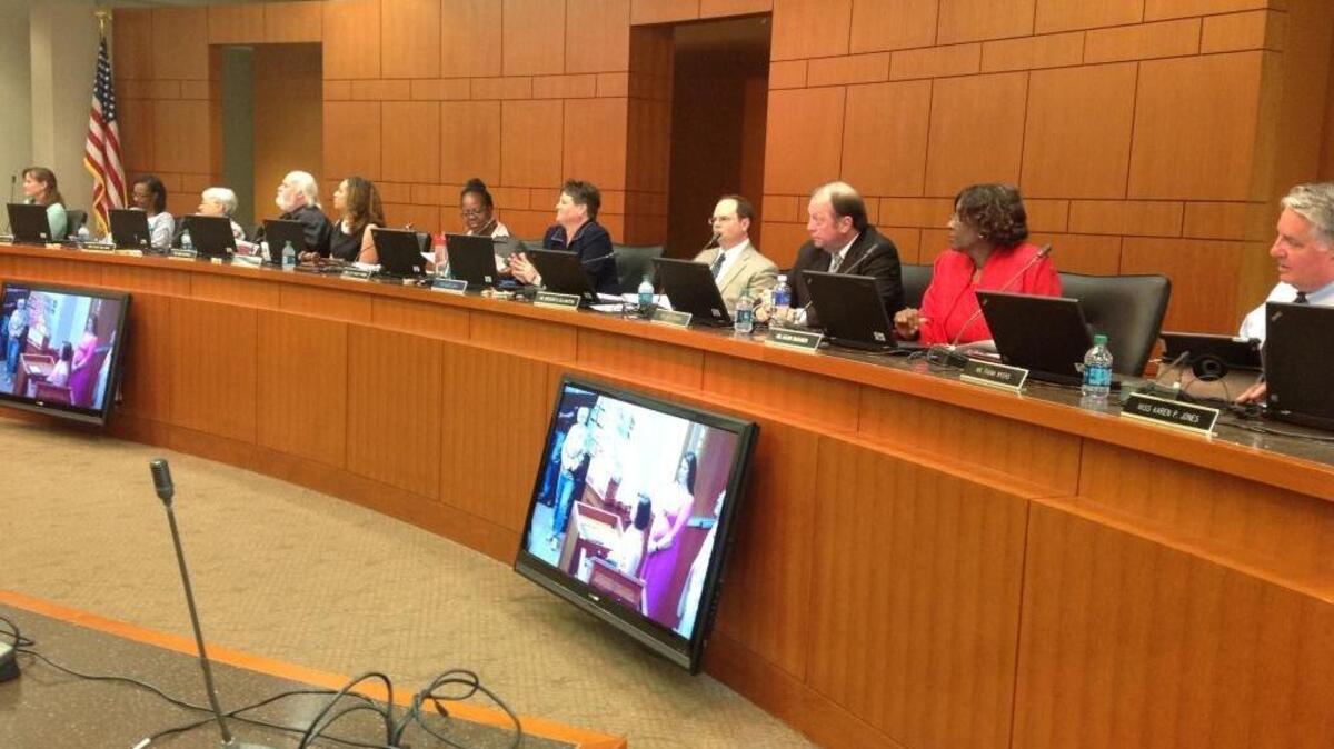 Muscogee County School District assistant superintendent Rebecca Braaten, seventh from left, fills in for superintendent David Lewis during Monday night’s Muscogee County School Board meeting in the Muscogee County Public Education Center. Lewis said last week he would miss the meeting because he would be out of town to attend his daughter’s college softball senior banquet.