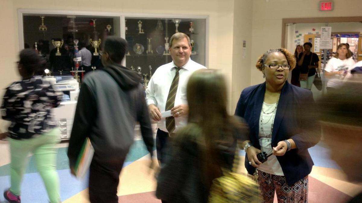 Double Churches Middle School principal Craig Fitts and assistant principal Lashonda Milledge-Miller monitor students as they change classes.