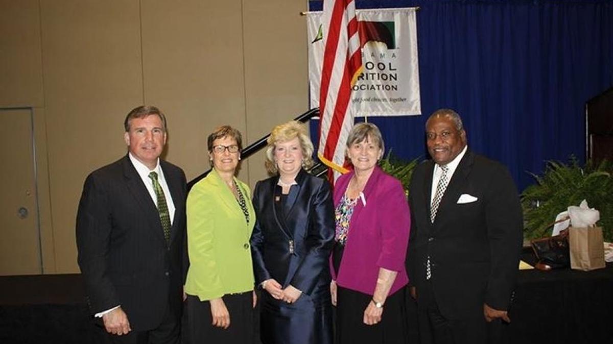 Brindlea Griffin of Phenix City Schools, center, was named the Alabama School Nutrition Director of the Year and installed as the Alabama School Nutrition Association’s president during its annual conference, March 11-12, at the Renaissance Hotel and Spa in Montgomery. Pictured with Griffin as, from left, Phenix City Schools superintendent Randy Wilkes, USDA deputy under secretary for family nutrition consumer services Katie Wilson, Alabama Child Nutrition Programs state coordinator June Barrett and Phenix City Mayor Eddie Lowe.