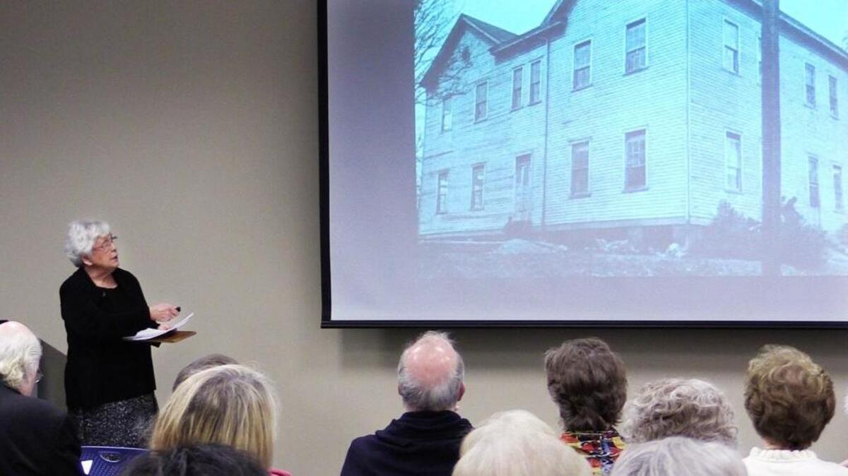 Libba Russell speaks Thursday afternoon during a program titled "History of Black Education in Columbus" program at the Mildred L. Terry Library in Columbus. The program is part of Historic Columbus' 2017 Lunch and Lecture Series. Here, Russell is showing a photograph of the original Claflin School building.