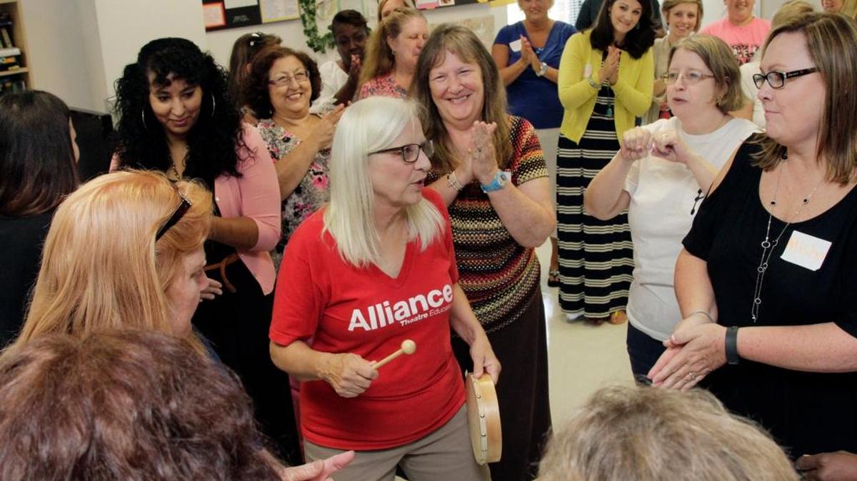Claire Ritzler, center, a teaching artists with Wolf Trap Institute for Learning, works with a classroom of kindergarten teachers and paraprofessionals from across Muscogee Count in arts-integrated concepts that they can bring into their classrooms. About 230 kindergarten teachers and paraprofessionals attended the all-day workshop held Tuesday at Northside High School.