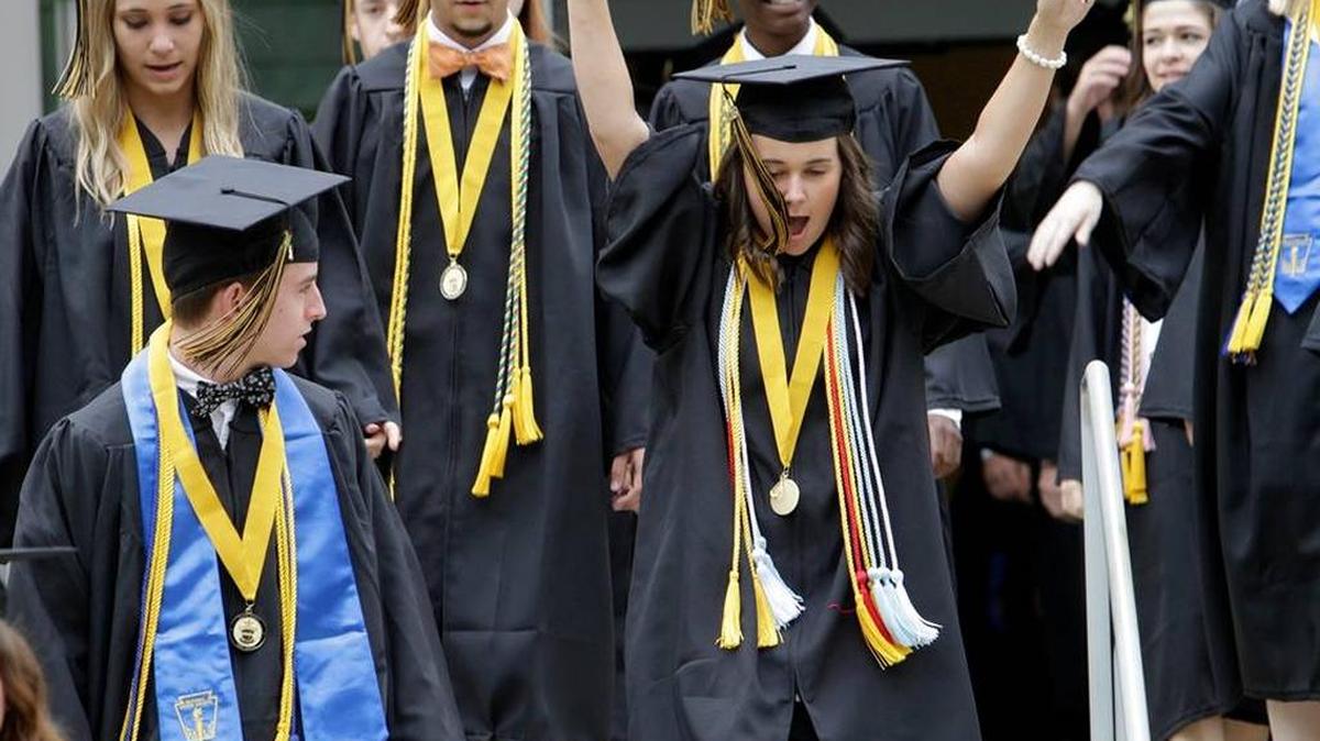 Harris County High seniors march toward the Columbus State University Lumpkin Center for graduation ceremonies on May 21, 2016.