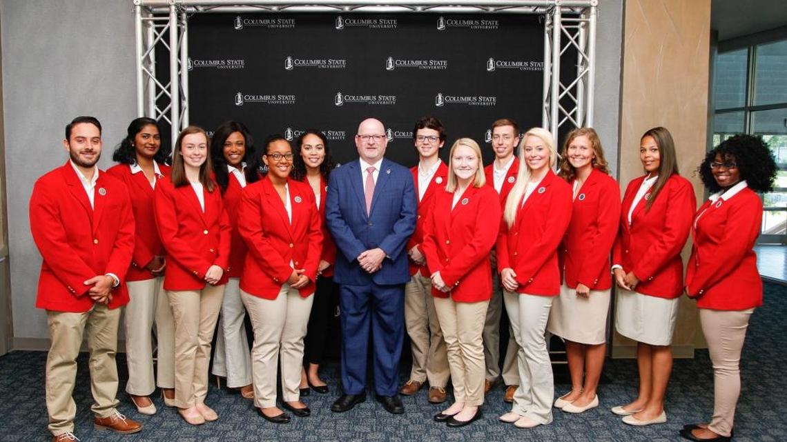 Columbus State University president Chris Markwood poses with CSU’s inaugural group of Presidential Envoys.
