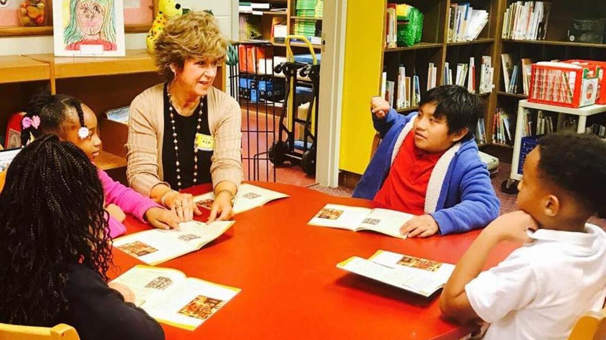 Helen Johnson, group vice president for community development at Columbus Bank and Trust, helps South Columbus Elementary School third-graders with their reading comprehension, listening and writing skills. Three mornings per week, three volunteers from CB&T visit the school to implement this initiative, part of the company’s Partner in Education program with South Columbus and supporting the Greater Columbus Chamber of Commerce 2025 Strategy to improve language arts skills in local schools.