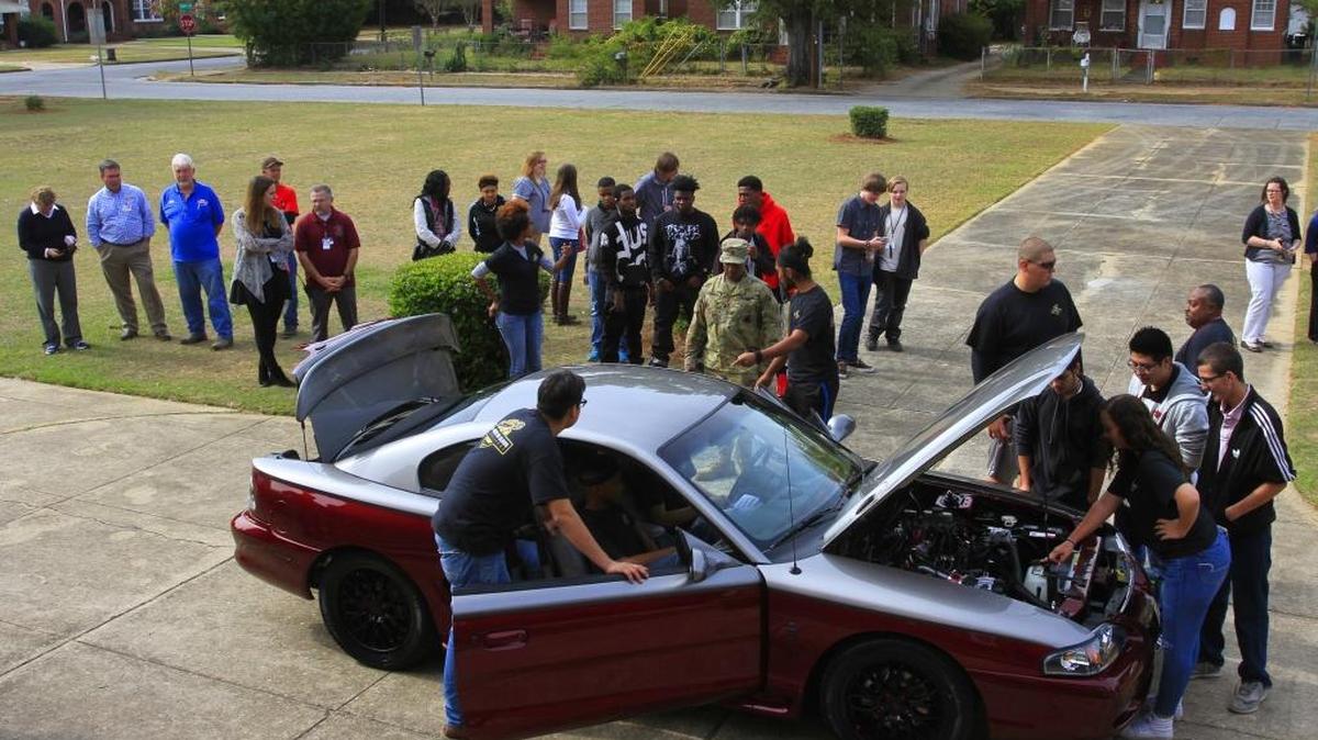 Students in Jordan Vocational High School's automotive program revealed Wednesday to other students, faculty and the community the 1996 Ford Mustang they restored and improved as part of the Quaker State's Best in Class Challenge. The car will now be judged and compete with the Mustangs restored by the other four national finalists for the grand prize. Go to www.ledger-enquirer.com for video from the reveal.