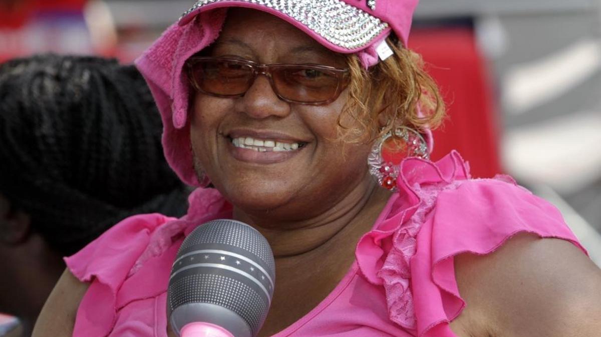 Jeraldine Hodges of Harris County sings to the live music during Family Day in the Park at Woodruff Park on Saturday.