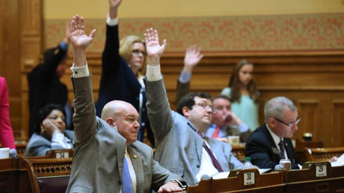Senators motion to resolve the debate on HB859, which would legalize firearms on all public colleges in Georgia, at the Georgia State Capitol on Friday, March 11, 2016. The Georgia Senate on Friday gave final passage to a bill that for the first time would legalize firearms on all public colleges in Georgia, following an emotional two-hour floor debate over the wisdom of letting students carry concealed guns on campus.