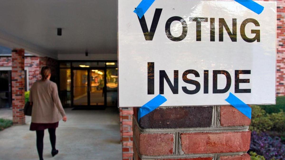 A voter walks into the precinct at Columbus’ Epworth United Methodist Church at 2400 Devonshire Drive.