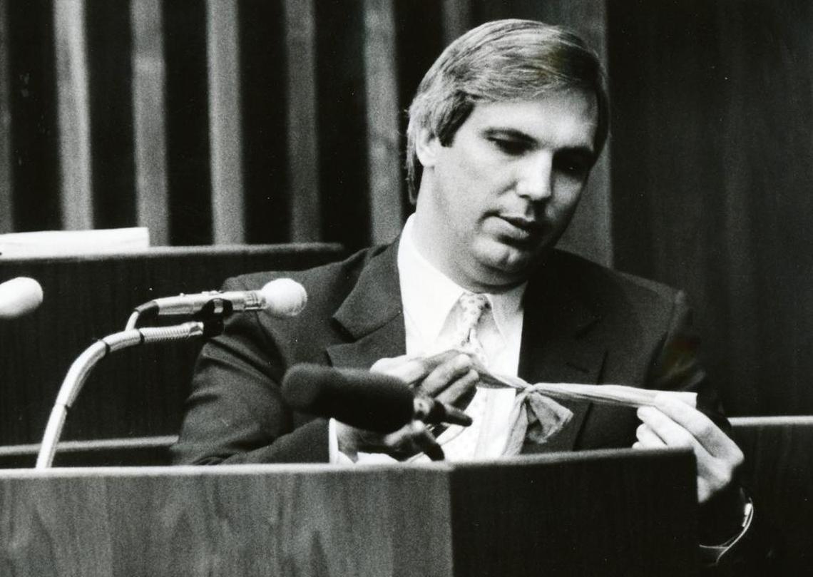 An investigator holds knotted stockings during Carlton Gary’s 1986 trial.