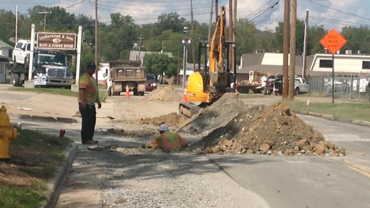 Crews from the Utilities Department install an 8-inch water line on 10th Avenue in Phenix City on Oct. 12, 2017 after bad soil damaged the newly paved street. The water line may be completed by the end of this week.