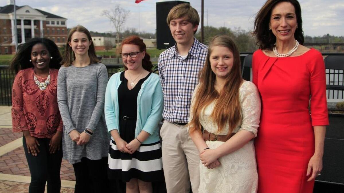 Columbus Mayor Teresa Tomlinson, right, poses Monday afternoon with recipients of the Together 2016 Scholarships. The recipients are Alana Robinson of Carver High School, Sydney Weisenburger of Harris County High School, Haley Rice of Russell County High School, David Pharis of Columbus High School and Cierra Nell of Jordan Vocational High School.