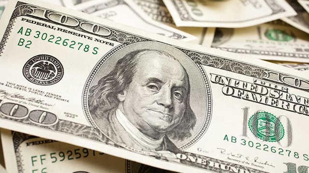 The one-hundred dollar bill displays Benjamin Franklin on the front.
