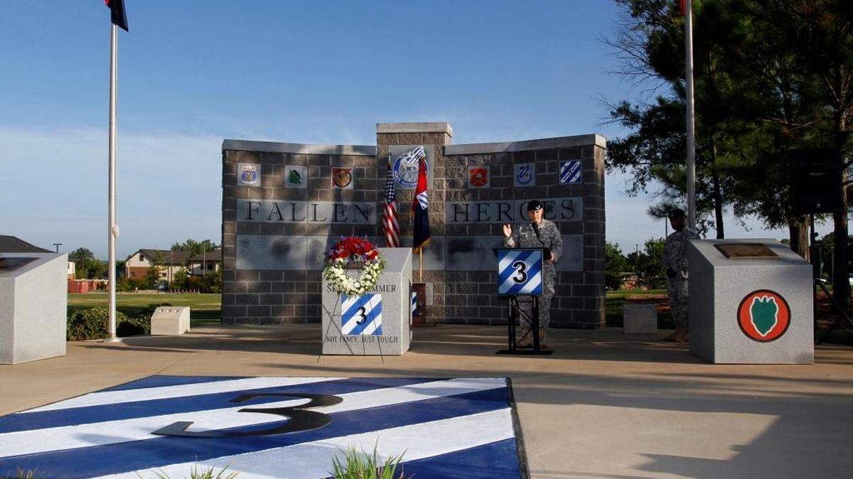 Chaplain Loren Hutsell addresses the 3rd Armored Brigade Combat Team soldiers gathered for the 9/11 Memorial Service wreath presentation at the Fallen Heroes Memorial on Kelley Hill in September 2014. The 80 names of 3rd Brigade soldiers who have been killed in the post-9/11 war in Iraq are engraved on the memorial: 45 on the wall, and 35 on the central pillar. 09.11.14