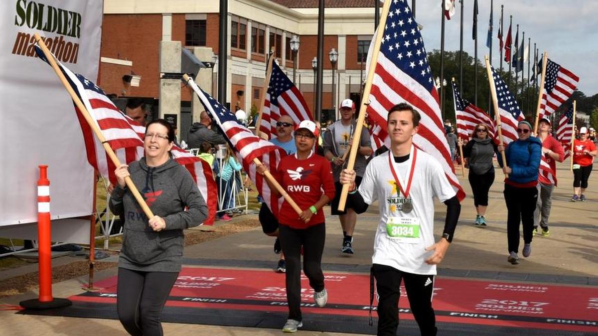Runners cross the finish line of Saturday’s 2017 Soldier Marathon at the National Infantry Museum and Soldier Center.