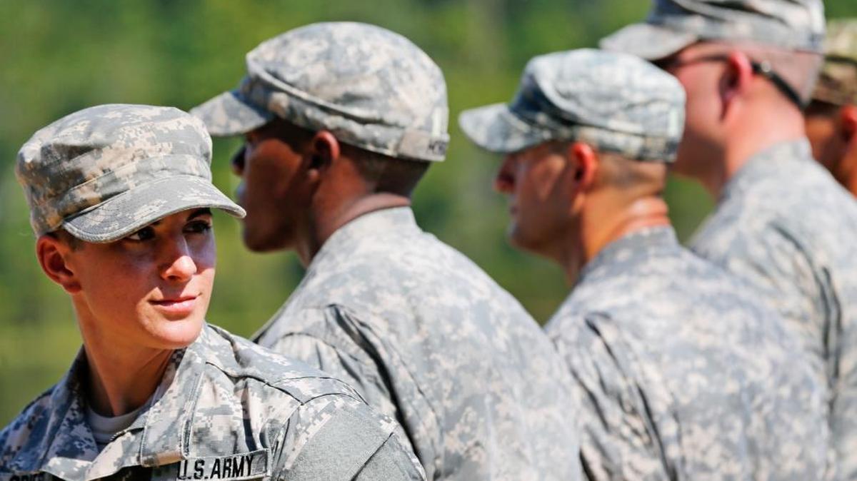 U.S. Army Capt. Kristen Griest, left, of Orange, Conn., stands in formation during an Army Ranger School graduation ceremony, Friday, Aug. 21, 2015, at Fort Benning, Ga. Griest and First Lt. Shaye Haver became the first female soldiers to complete the Army's rigorous school, putting a spotlight on the debate over women in combat.