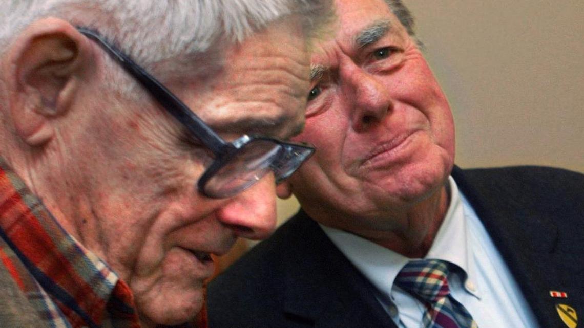 Veteran war correspondent and author Joe Galloway, right, shares stories with Sgt.Maj. (Ret.) Basil Plumley before Galloway's talk at the Columbus Public Library Monday evening. Plumley was the ranking NCO with the 1st Battalion, 7th Cavalry Regiment, and Galloway was a young reporter during the battle at Ia Drang in Vietnam, the basis for Galloway's book, "We Were Soldiers Once ... and Young."