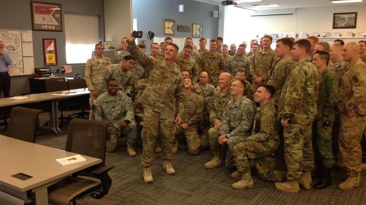 Brig. Gen. Malcolm Frost takes a selfie with students in the Captains Career Course at Fort Benning.