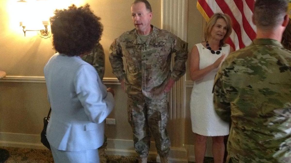 New armor commandant Brig. Gen. John S. Kolasheski and his wife, Buffy, greet well-wishers at his welcoming ceremony Friday at The Benning Club.
