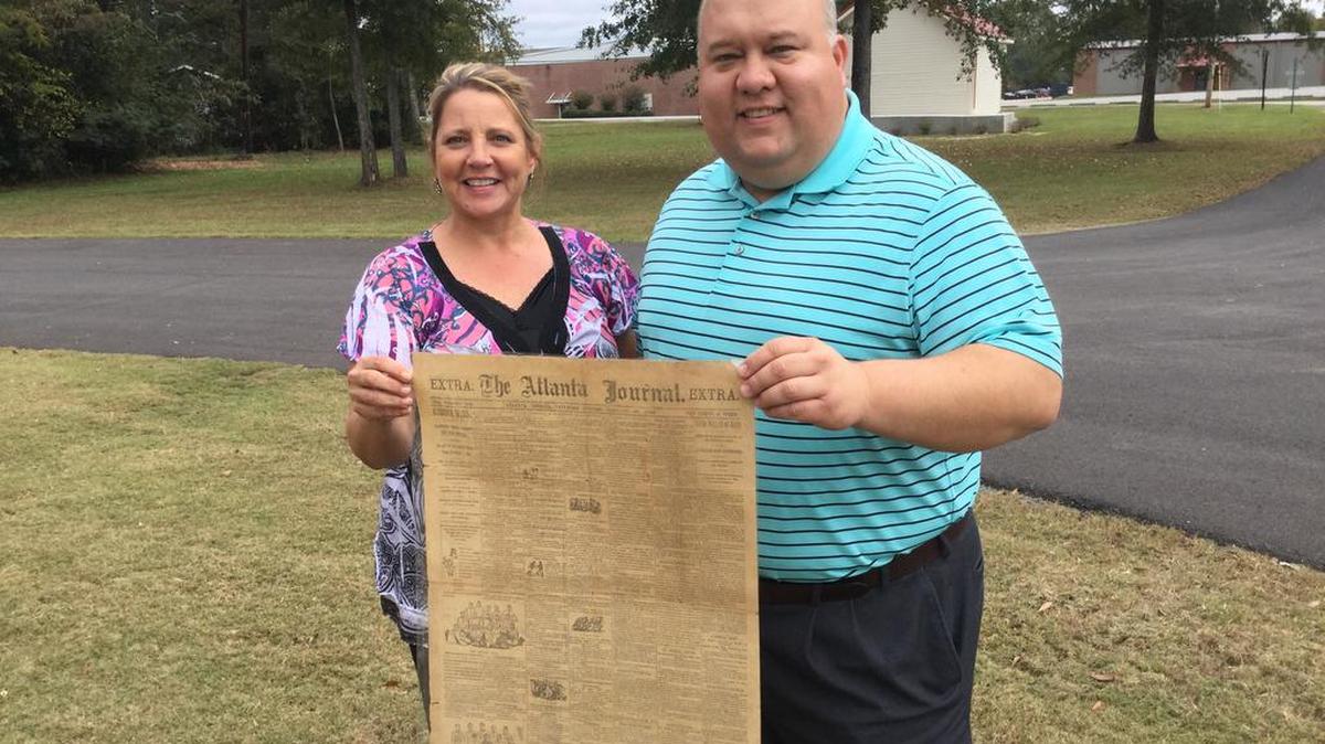 Lisa Deason, F.L. ‘Bubba’ Copeland show off old newspaper