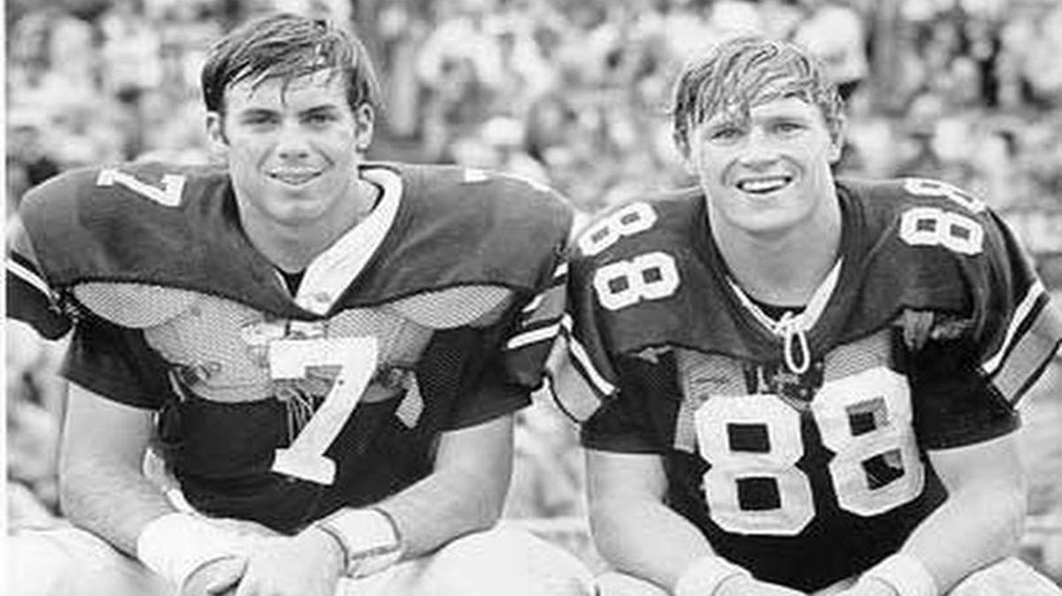 Former Auburn star receiver Terry Beasley (88), pictured with quarterback Pat Sullivan, suffered multiple concussions during his college and NFL playing days.