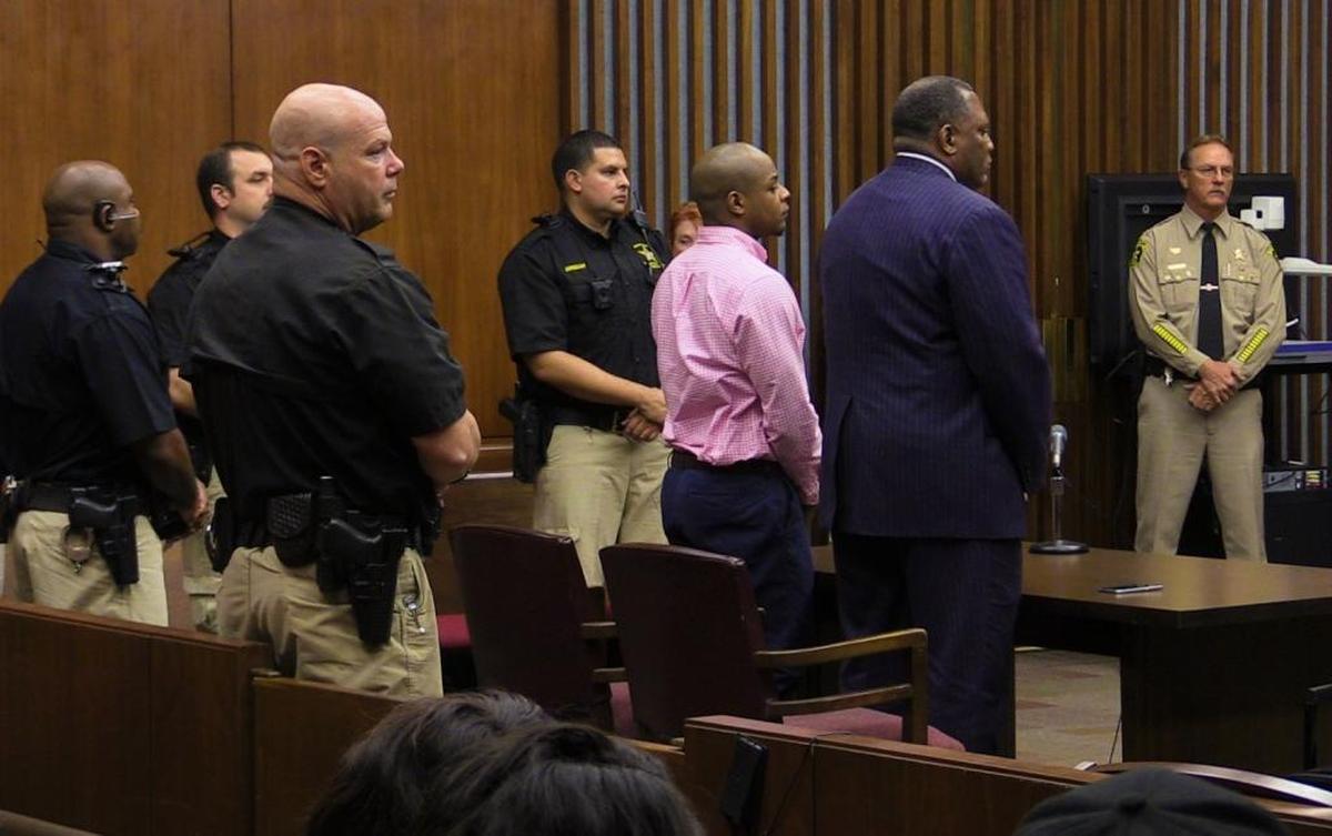 Gary Lee Jones Jr.,center, and his defense attorney Michael Eddings, to Jones' right, stand as the jury enters the courtroom Friday afternoon to deliver its verdict.