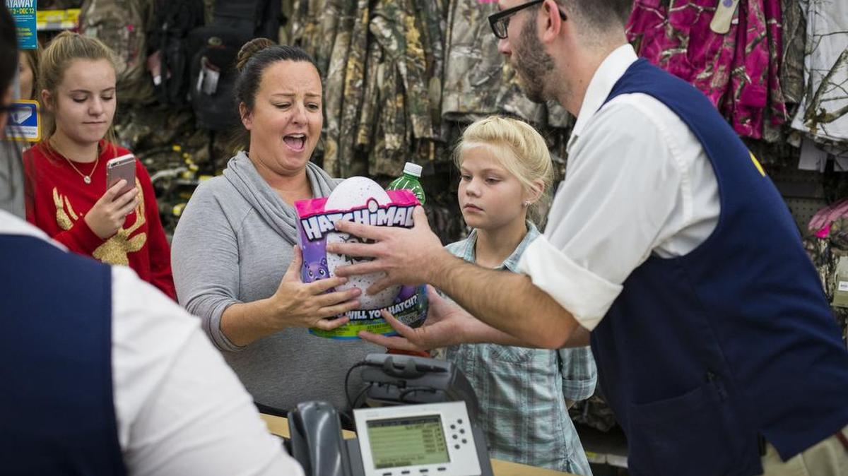 Kelly Ingram reacts while receiving a Hatchimal, a top toy of the season, at Walmart’s Black Friday event in Bentonville, AR on Nov. 24, 2016.