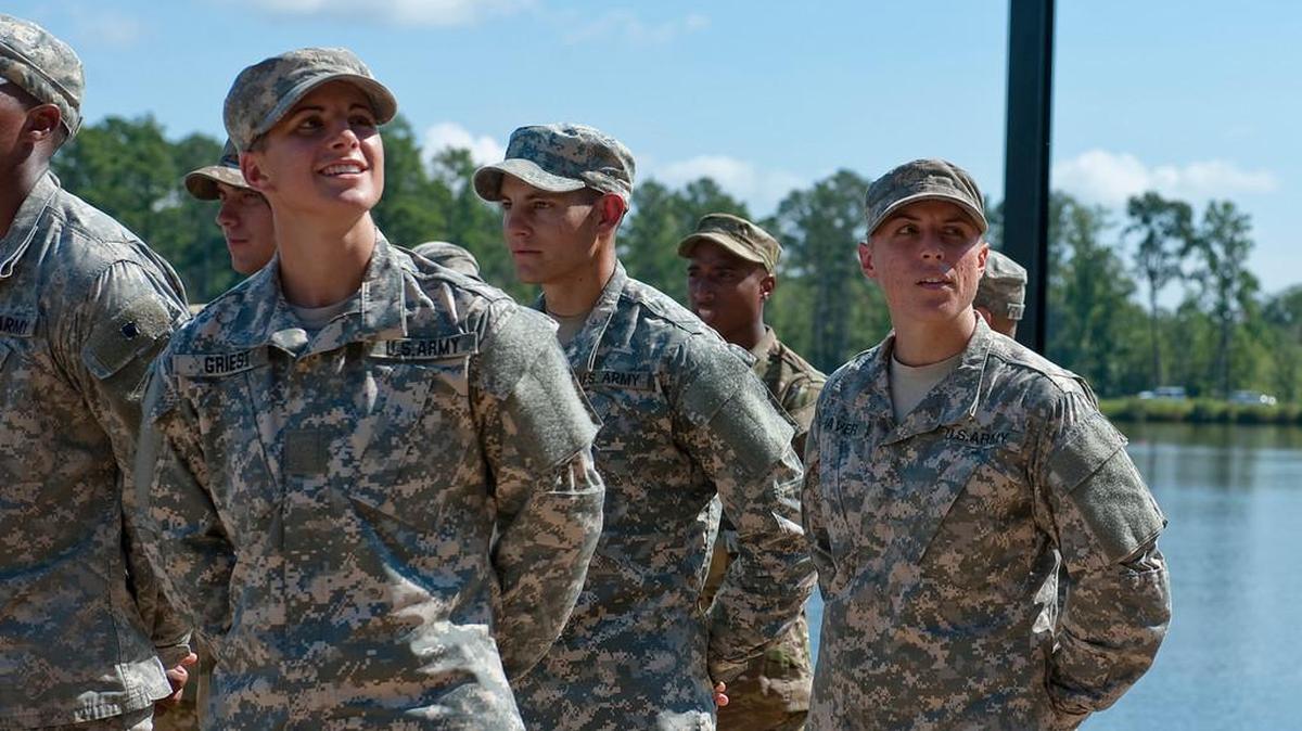 Capt. Kristen Griest, left, and 1st Lt. Shaye Haver look into the crowd in 2015 during their Ranger School graduation.