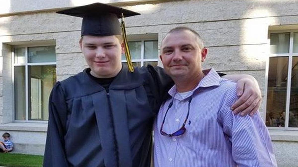 Alabama State Trooper Zack Harrelson, right, went to Michigan on Thursday to watch Austin Kidder graduate from high school.