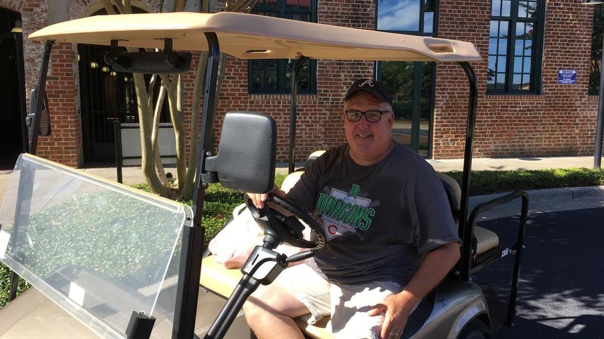 Chuck Williams enjoying the downtown golf cart life on a Saturday morning.