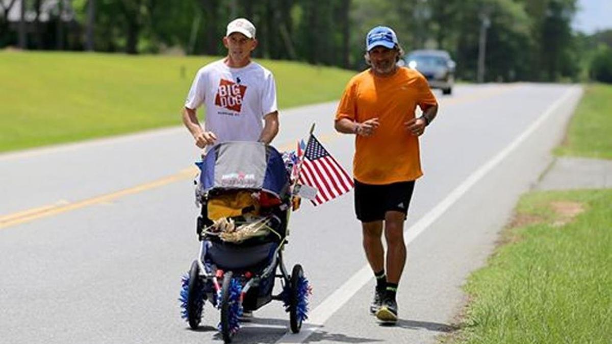 Big Dog Running Co., co-owner John Teeples, left, and George Gurrola are pushing a stroller called “Jenny Wilson” from Columbus to Savannah, marking the course for the Run Across Georgia.