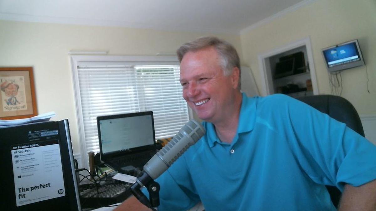 Talk radio host Doug Kellett, with a Columbus Ledger-Enquirer article framed on the wall, works out of his Peachtree, Ga., studio.
