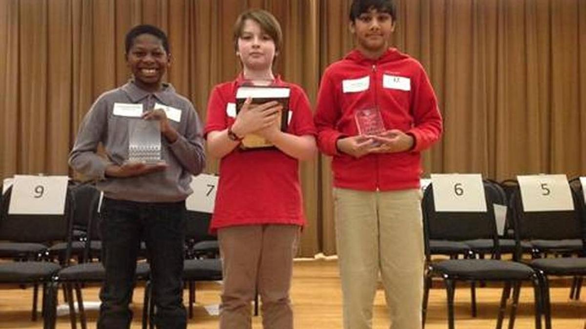 Hannan Magnet Academy fifth-grader Owen Steele, center, won the 2018 Muscogee County School District Spelling Bee on Wednesday in Columbus Museum. Posing with him after the competition are, from left, runner-up Christopher Holley, a Blanchard Elementary School fifth-grader, and third-place finisher Aadi Shah, a Britt David Magnet Academy fifth-grader.