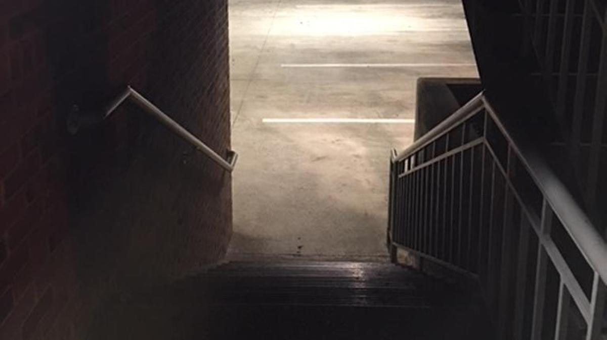 At the entryway to this parking deck, he turned his back on the teenagers and headed down to his car.