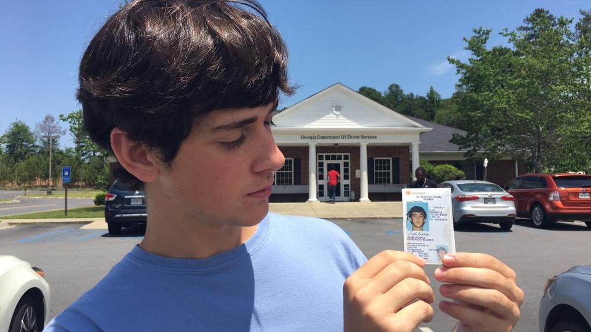 Joe Kendrick-Holmes admires his learner’s permit last year. In a couple of days, if he avoids cruise control during the driver’s test, he’ll get the real deal.