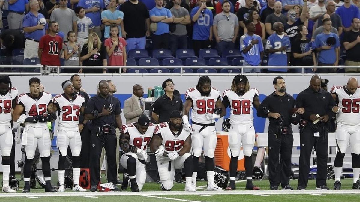 Some Falcons stood and some knelt during Sunday’s national anthem in Detroit.