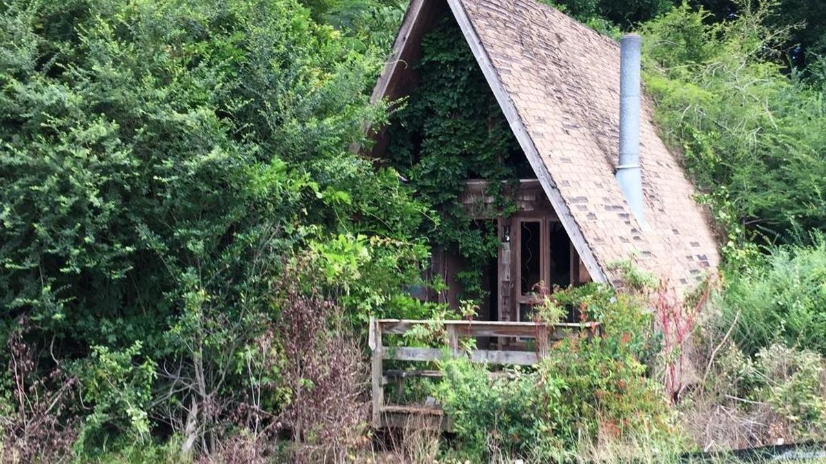 This old A-frame cabin used to be in the woods before the right of way for the Veterans Parkway widening project was cleared.