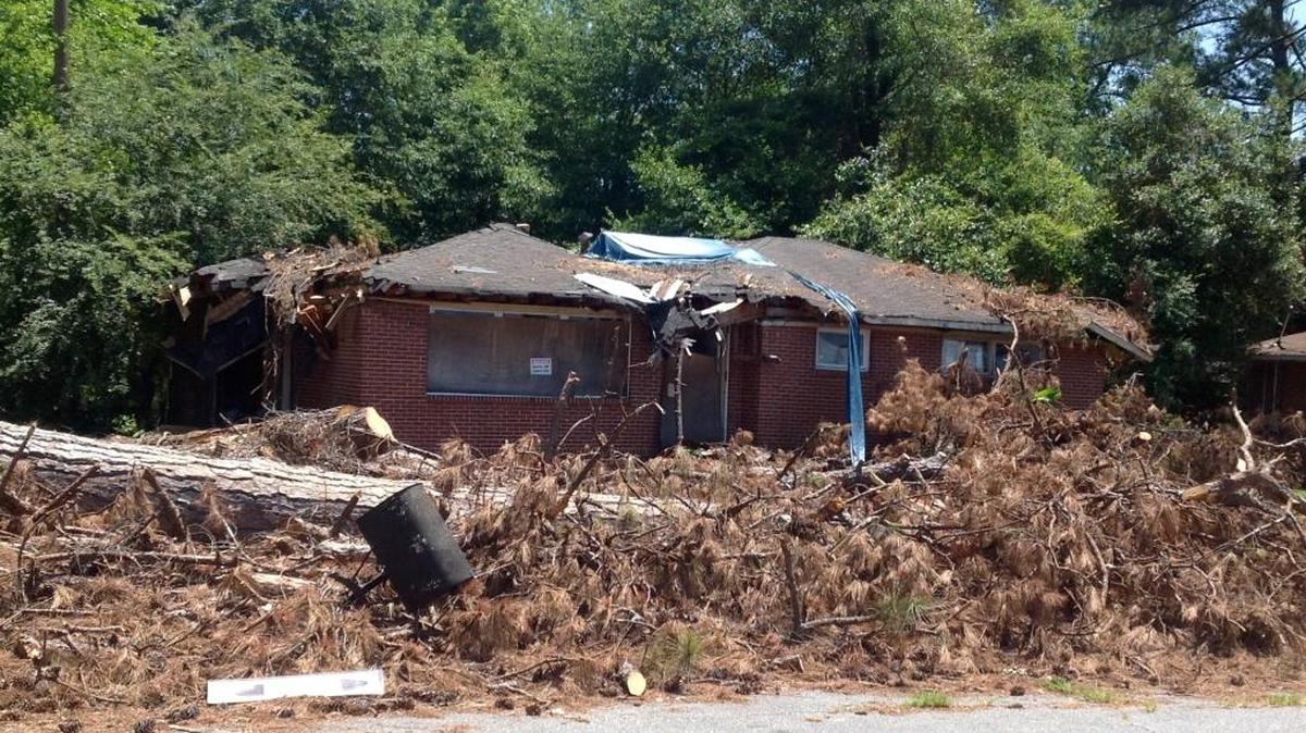 This house and its accompanying mess are supposed to be demolished and hauled away.