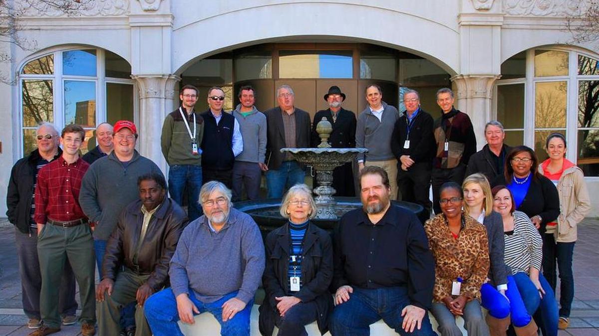 Mike Owen joins colleagues from the Ledger-Enquirer newsroom for a photo at the old building on 12th Street on their last day there in early 2015.