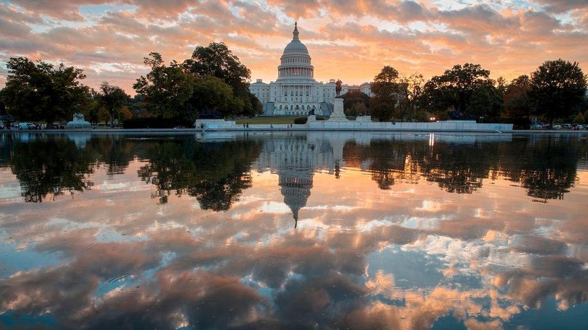 FILE - In this Oct. 10, 2017, file photo, the Capitol is seen at sunrise, in Washington.