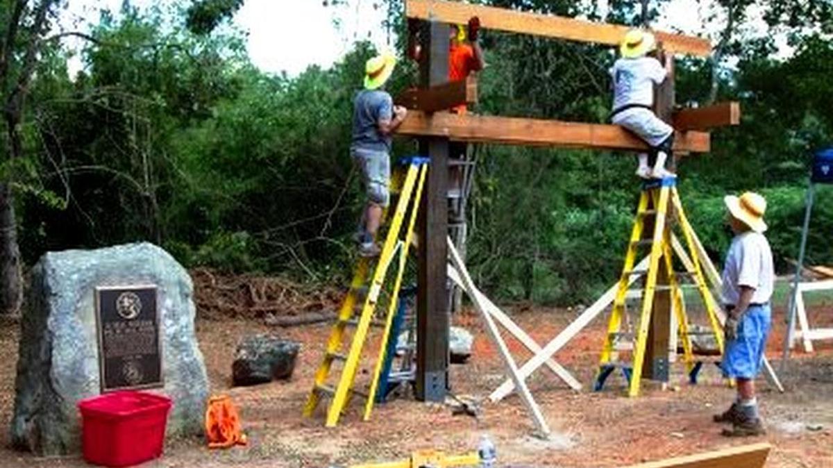 Pine Mountain Trail Association volunteers work on the now-completed map kiosk on the trail’s eastern end.