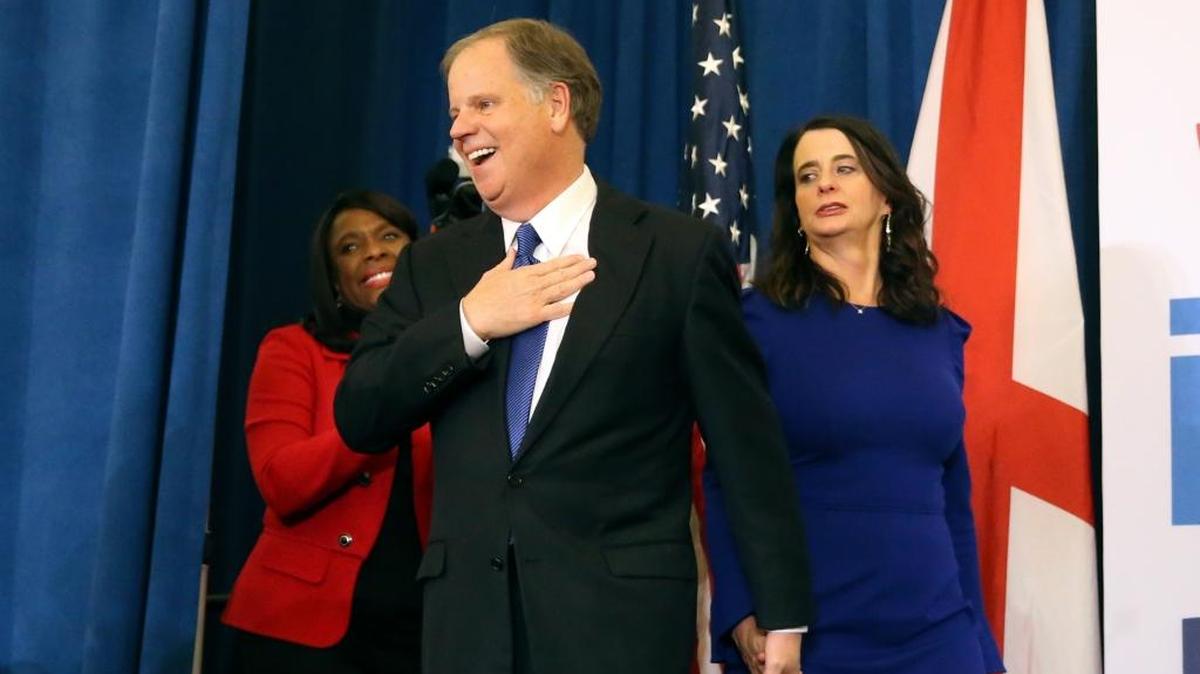 Democratic candidate for U.S. Senate Doug Jones and his wife Louise walk on stage to speak during an election-night watch party Tuesday, Dec. 12, 2017, in Birmingham, Ala. Jones defeated Republican Roy Moore.