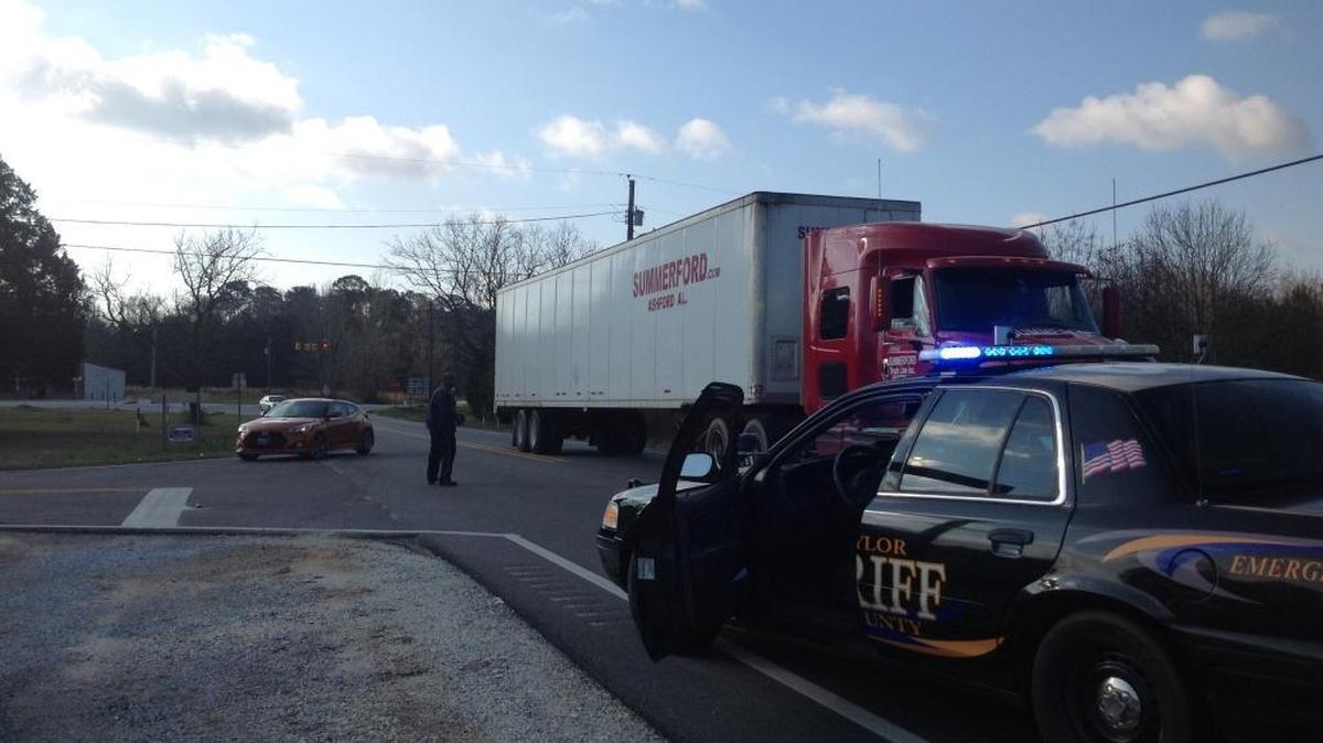 A Russell County Sheriff’s deputy directs traffic near Highway 169.