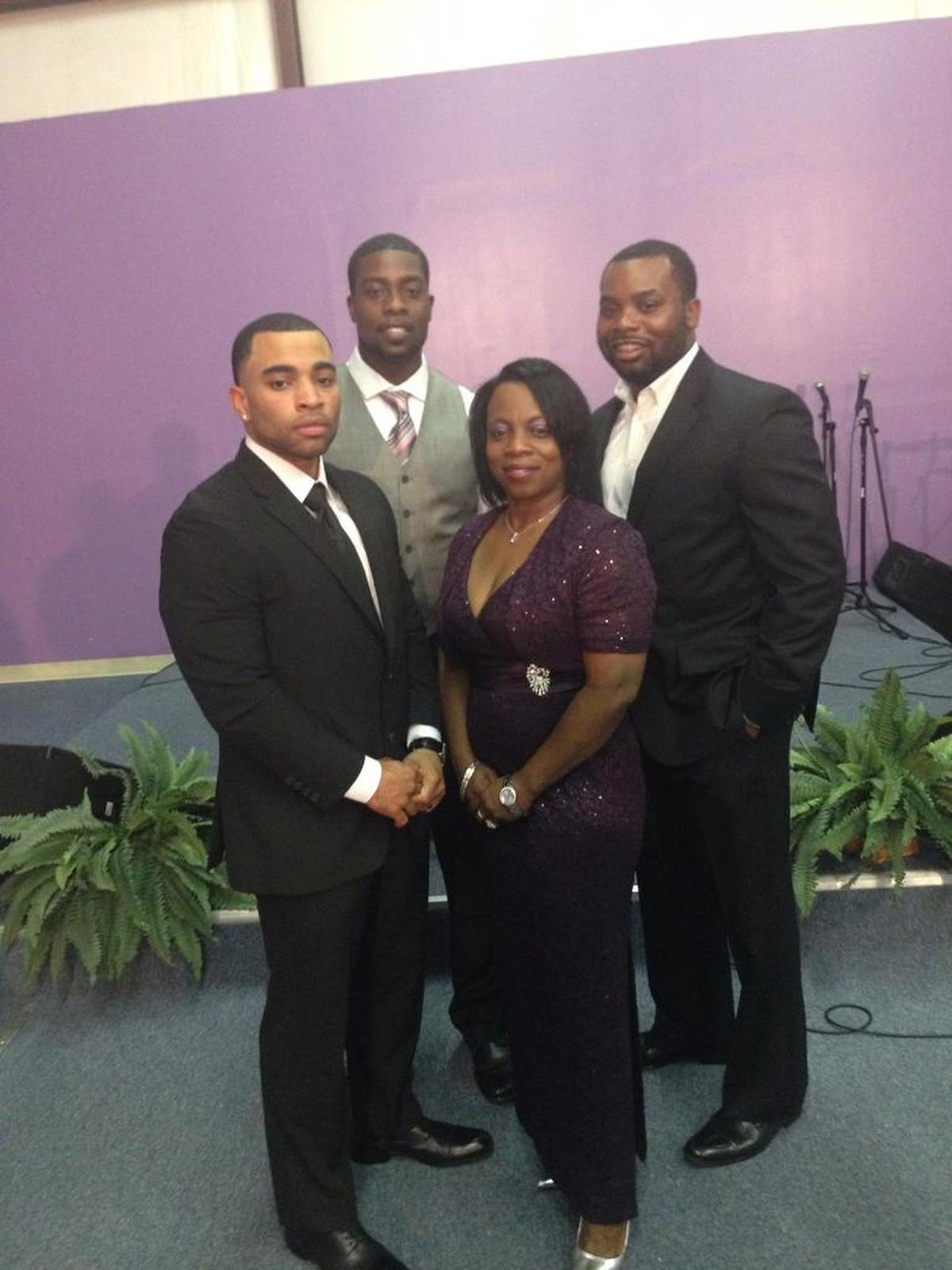 Antonio Bush, third man from the left, stands with his mother, Victoria,, and two brothers, Zack and Gabe, at a wedding. He credits his mother with raising three successful sons while a single parent struggling to make ends meet.