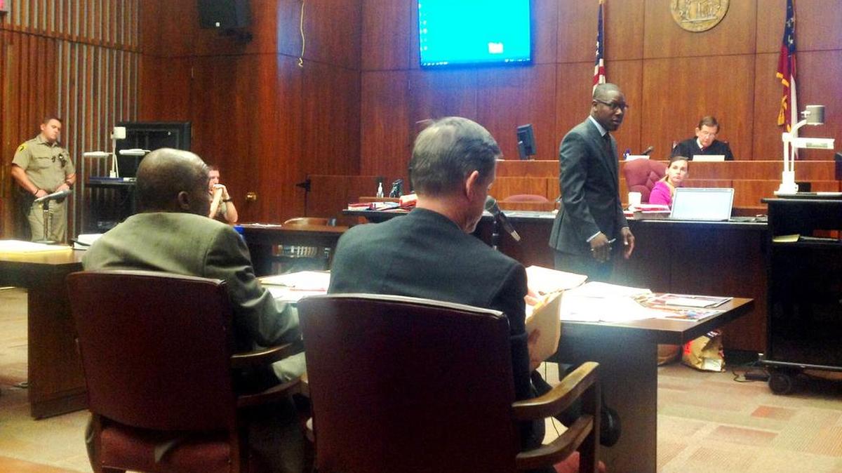 Prosecutors Al Whitaker and George Lipscomb watch as attorney Stacey Jackson makes his closing argument.