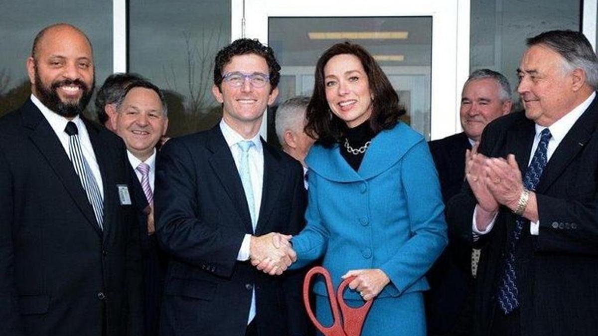 In this January 2014 photo, Pratt & Whitney Aftermarket President Matthew Bromberg shakes hands with Columbus Mayor Teresa Tomlinson at Pratt & Whitney’s F100 engine overhaul center grand opening. Columbus Councilor Bruce Huff is at left, and Dick Ellis, chairman of the Columbus Development Authority, is at right.