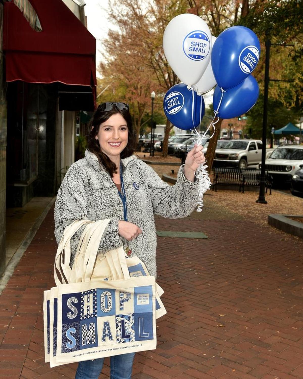 Uptown Inc.’s Haley Green on Broadway helping to promote Small Business Saturday, November 25, 2017