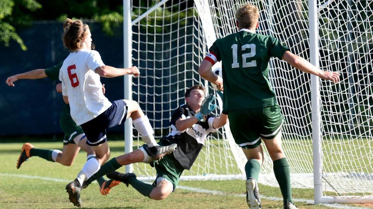 Pacelli's TJ Fick makes his way through the Aquinas defense en route to the goal in the Vikings' playoff game on May 3, 2018