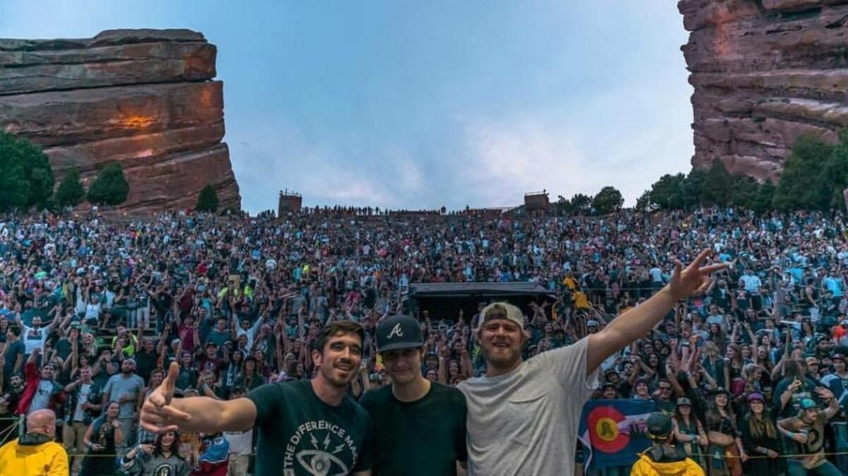 Hip-hop artist Obeah, left, who was known as Adam Venable when he graduated from Hardaway High School in 2002, performs with Rhett Whatley (aka Daily Bread), center, and drummer Eric Jefferson on Aug. 12, 2017, at the Red Rocks Amphitheatre in Morrison, Colorado.