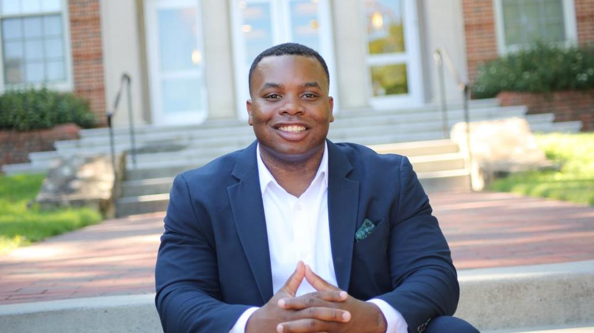 Antonio Bush sits at the entrance of Beard Hall -UNC Eshelman School of Pharmacy.
